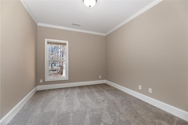 empty room featuring ornamental molding, visible vents, baseboards, and carpet flooring