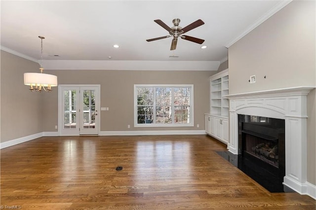 unfurnished living room featuring baseboards, dark wood finished floors, and ornamental molding