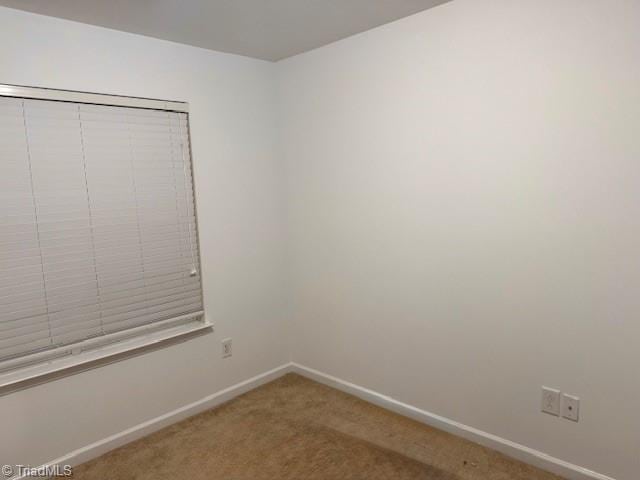 unfurnished room with carpet floors