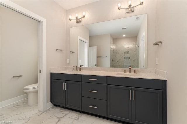 bathroom with dual vanity, tile floors, toilet, and tiled shower