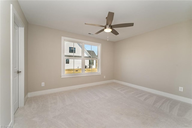 carpeted empty room with ceiling fan