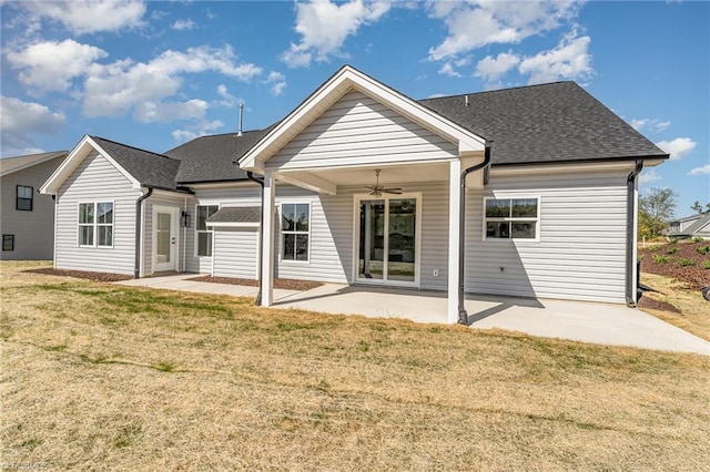 rear view of house featuring a yard, ceiling fan, and a patio