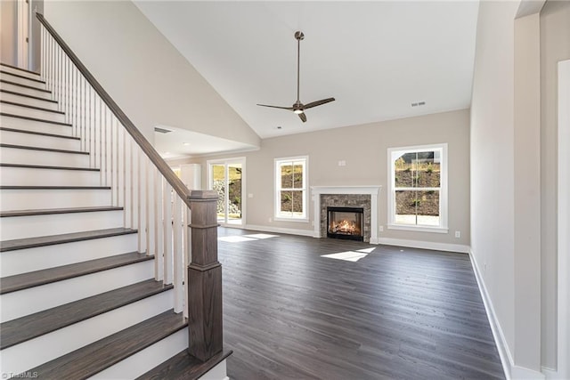 interior space featuring high vaulted ceiling, ceiling fan, and dark hardwood / wood-style floors