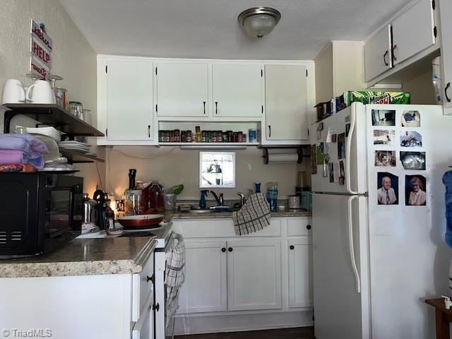 518 Playground Rd, Archdale, NC 27263 - kitchen featuring white appliances, open shelves, white cabinets, and a sink