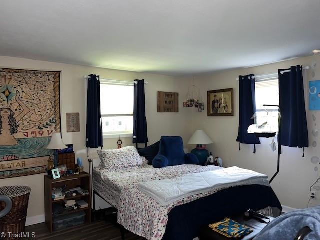 518 Playground Rd, Archdale, NC 27263 - bedroom featuring multiple windows, baseboards, and dark wood finished floors