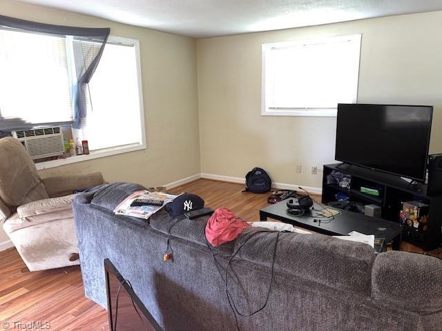 518 Playground Rd, Archdale, NC 27263 - living area featuring healthy amount of natural light, wood finished floors, and baseboards