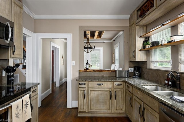 609 W Lexington Ave, High Point, NC 27262 - kitchen with dishwasher, stainless steel microwave, ornamental molding, and dark stone counters