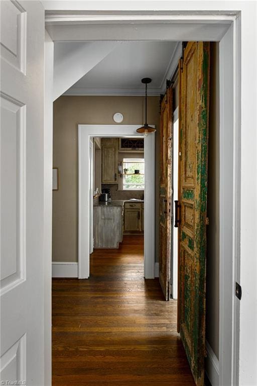 609 W Lexington Ave, High Point, NC 27262 - hall with crown molding, dark wood-type flooring, and a barn door
