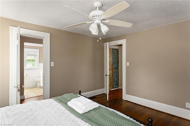 609 W Lexington Ave, High Point, NC 27262 - bedroom with wood finished floors, a textured ceiling, and a ceiling fan