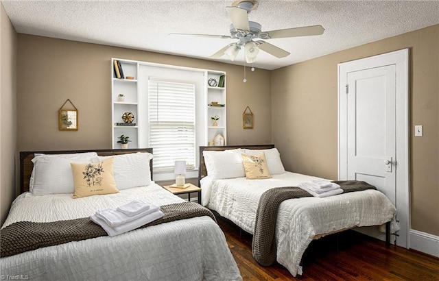 609 W Lexington Ave, High Point, NC 27262 - bedroom with wood finished floors, ceiling fan, and a textured ceiling