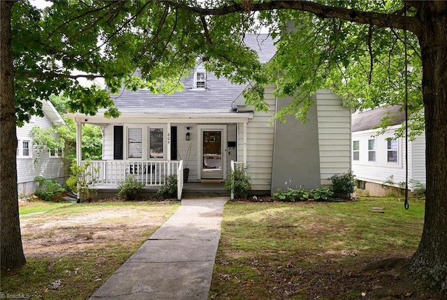 609 W Lexington Ave, High Point, NC 27262 - view of front facade with covered porch, a front lawn, and roof with shingles