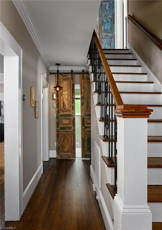 609 W Lexington Ave, High Point, NC 27262 - stairway featuring wood finished floors, ornamental molding, and a barn door