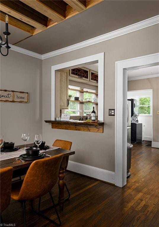 609 W Lexington Ave, High Point, NC 27262 - dining space with dark wood-type flooring and ornamental molding