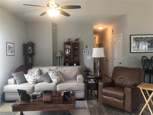 living room with wood finished floors and a ceiling fan