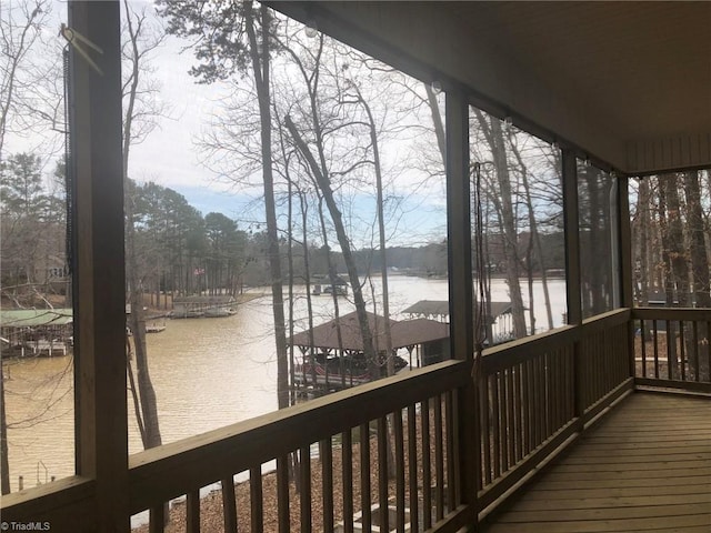 wooden deck featuring a water view