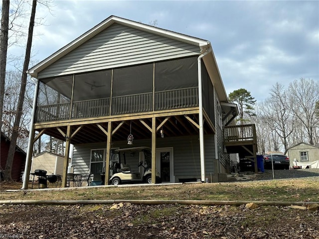 back of house featuring a sunroom