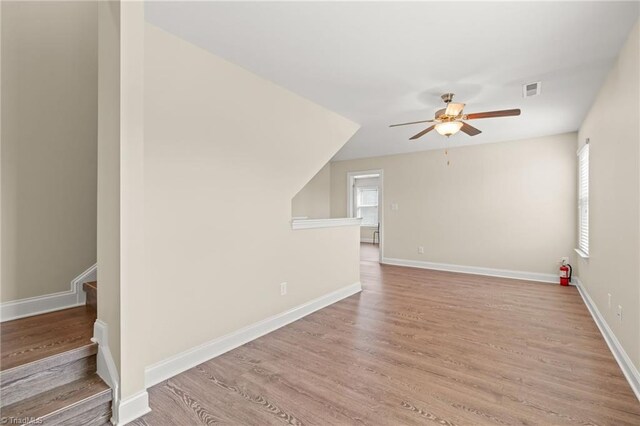 bonus room featuring ceiling fan and light wood-type flooring