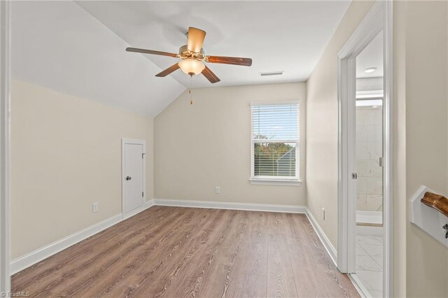 bonus room featuring lofted ceiling, light hardwood / wood-style floors, and ceiling fan