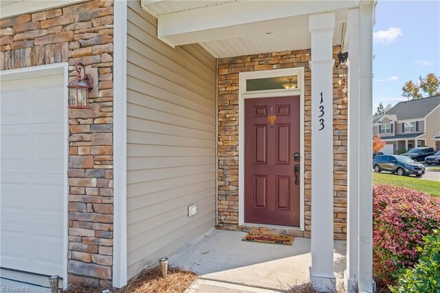 property entrance with a garage