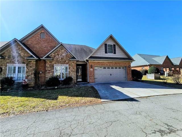 view of front of property featuring a garage and a front lawn