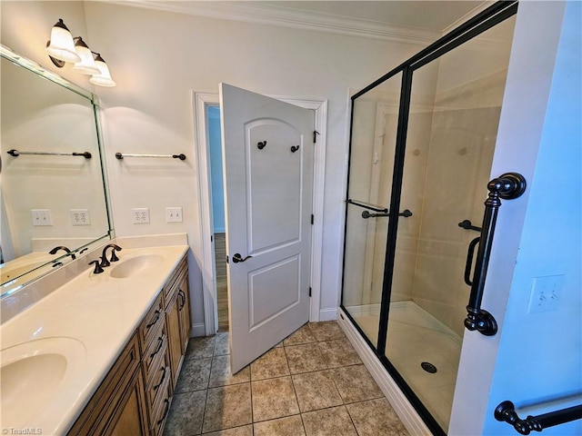 bathroom featuring walk in shower, tile patterned floors, crown molding, and vanity