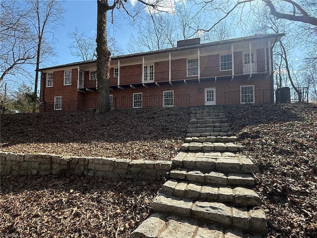 exterior space with brick siding