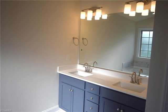 full bath with double vanity, a sink, a tub to relax in, and vaulted ceiling