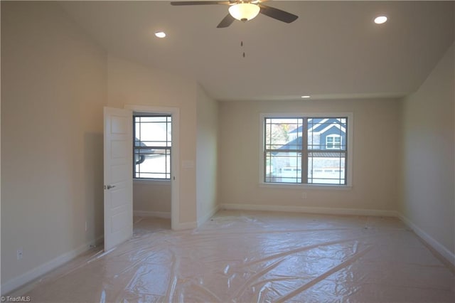 spare room with baseboards, a ceiling fan, vaulted ceiling, and recessed lighting