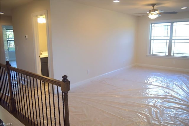 spare room featuring recessed lighting, baseboards, and ceiling fan