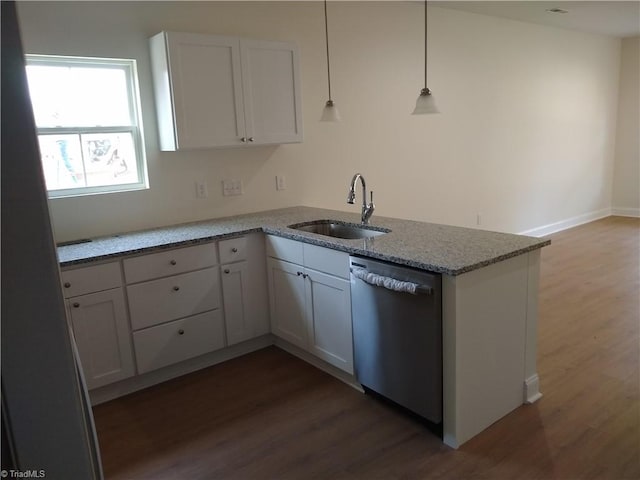 kitchen featuring sink, dishwasher, white cabinets, and wood-type flooring