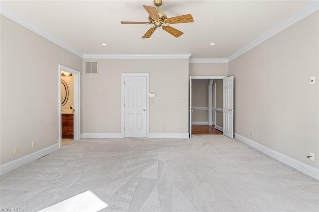 unfurnished bedroom featuring baseboards and crown molding