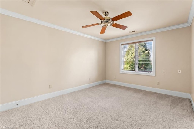 empty room with light carpet, visible vents, crown molding, and baseboards