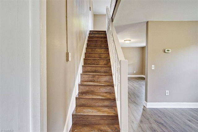 stairway featuring hardwood / wood-style floors