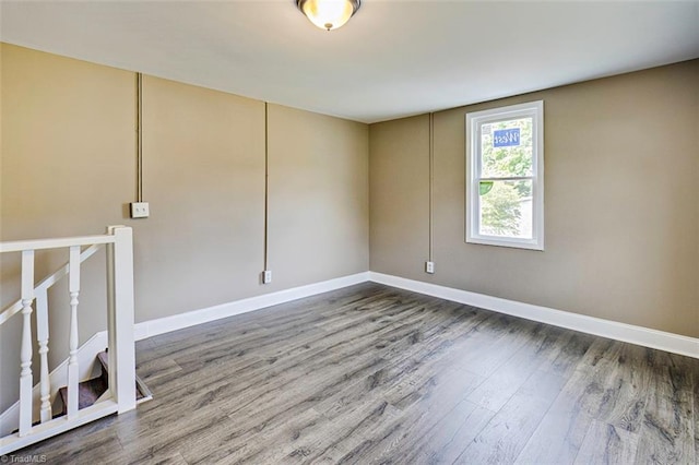 empty room with hardwood / wood-style floors