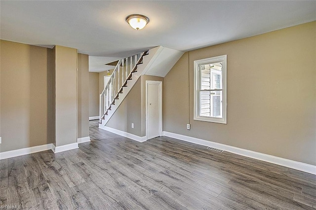 bonus room with wood-type flooring