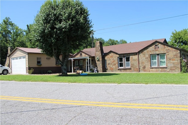 157 W Brocktown Rd, Moravian Falls, NC 28654 - ranch-style house with stone siding, a front yard, a garage, and a chimney