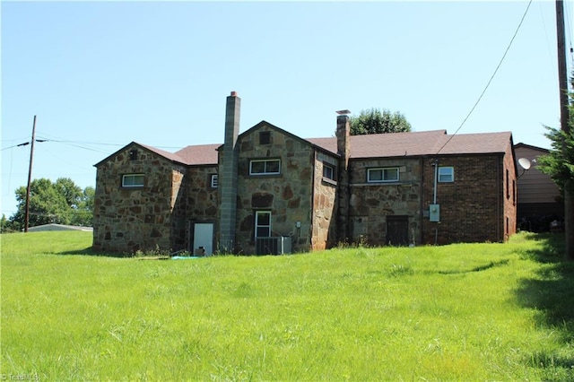 157 W Brocktown Rd, Moravian Falls, NC 28654 - back of house with stone siding and a chimney