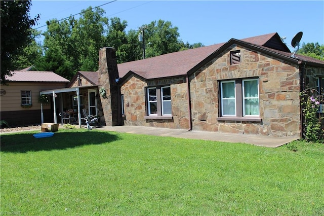 157 W Brocktown Rd, Moravian Falls, NC 28654 - rear view of property featuring stone siding, a lawn, and a chimney