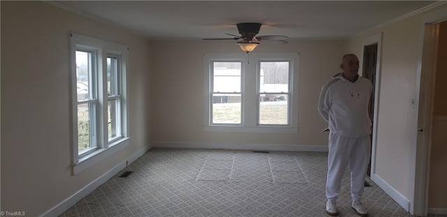 157 W Brocktown Rd, Moravian Falls, NC 28654 - spare room with plenty of natural light, crown molding, a ceiling fan, and light carpet