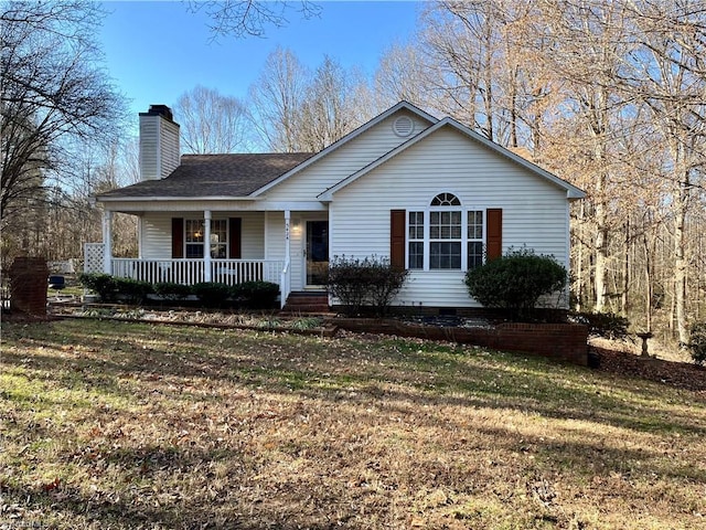 single story home with a front yard and covered porch