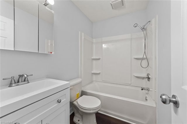 full bathroom featuring vanity, shower / bathtub combination, and toilet