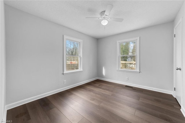 spare room featuring ceiling fan, a textured ceiling, and dark hardwood / wood-style flooring