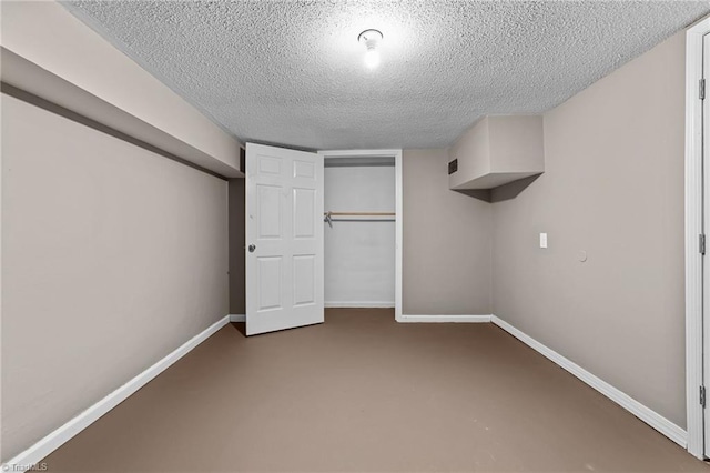 unfurnished bedroom with a closet and a textured ceiling