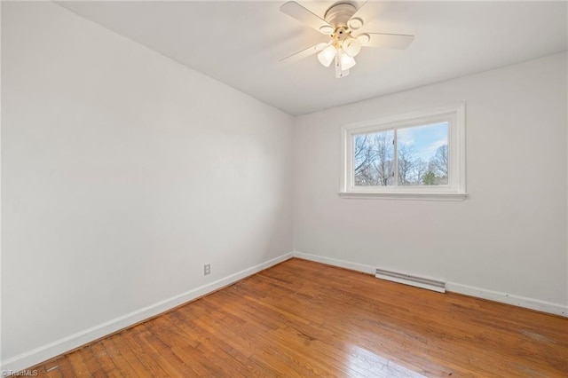 unfurnished room with ceiling fan, light wood-type flooring, visible vents, and baseboards