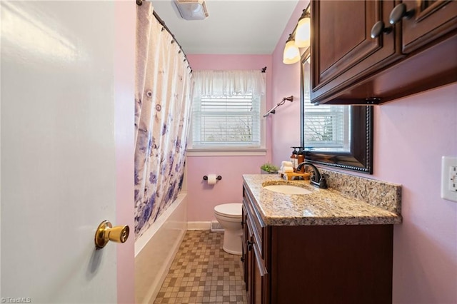 bathroom featuring baseboards, toilet, tile patterned floors, shower / bath combination with curtain, and vanity