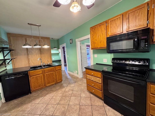 kitchen featuring pendant lighting, sink, light tile patterned floors, ceiling fan, and black appliances