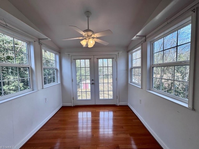 unfurnished sunroom with lofted ceiling, french doors, and ceiling fan