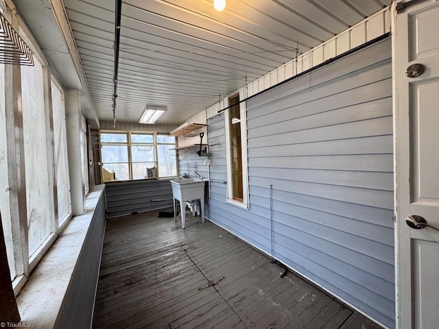 unfurnished sunroom featuring sink