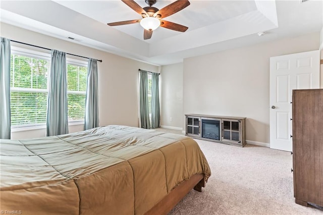 822 Blue Lake Dr, Mebane, NC 27302 - bedroom featuring a raised ceiling, carpet floors, and a ceiling fan