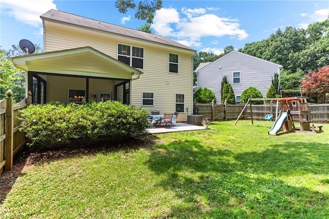 822 Blue Lake Dr, Mebane, NC 27302 - back of house with a patio area, a playground, and a fenced backyard